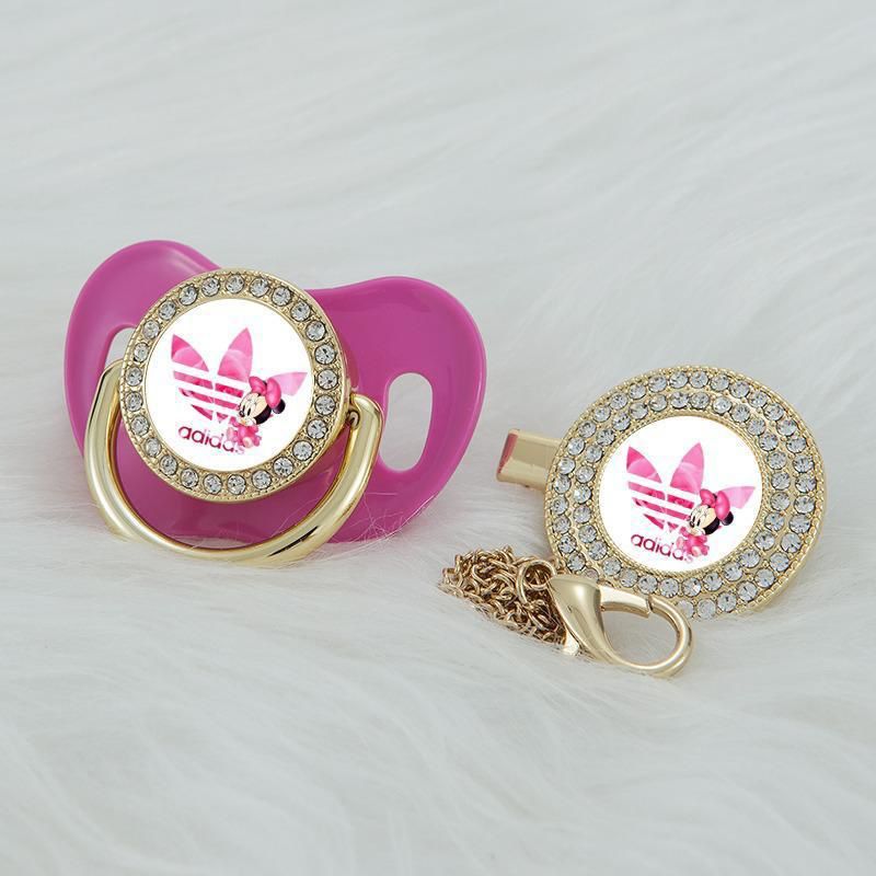 Premium Baby Schnuller adidas pink mit Minnie Maus im Druck mit Clip & Geschenkbox