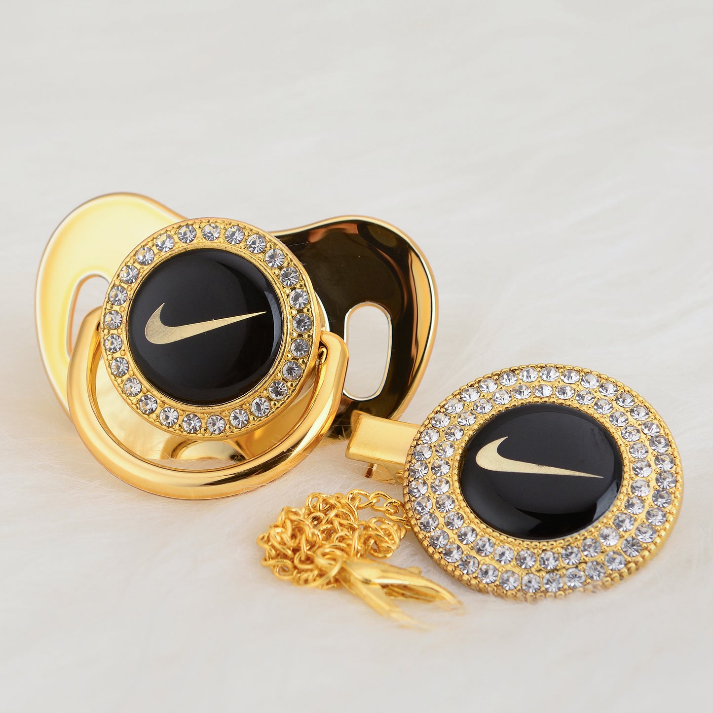 Premium Baby Schnuller Nike gold-schwarz mit Clip & Geschenkbox