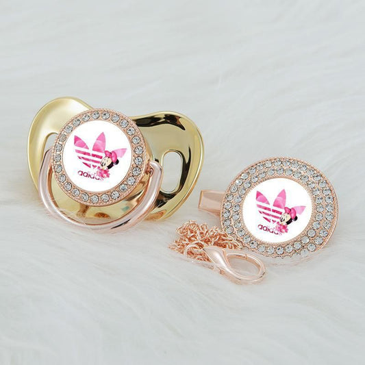 Premium Baby Schnuller adidas gold mit Minnie Maus im Druck mit Clip & Geschenkbox