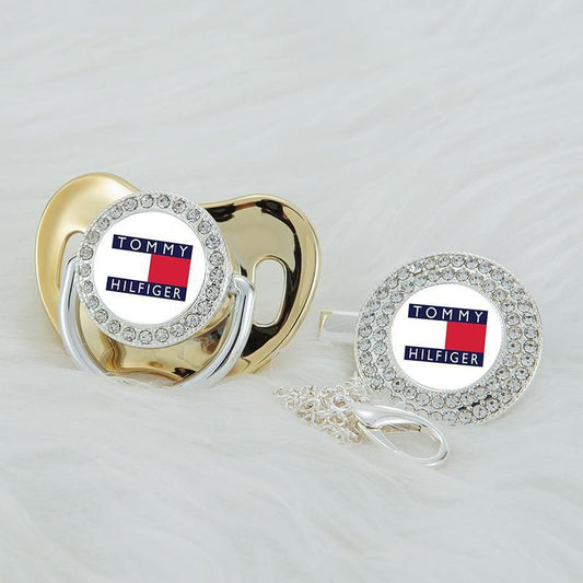 Premium Baby Schnuller Tommy Hilfiger gold mit Clip & Geschenkbox