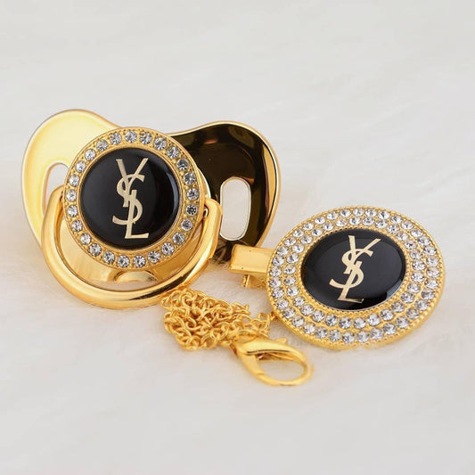 Premium Baby Schnuller Yves Saint Loren gold-schwarz mit Clip & Geschenkbox