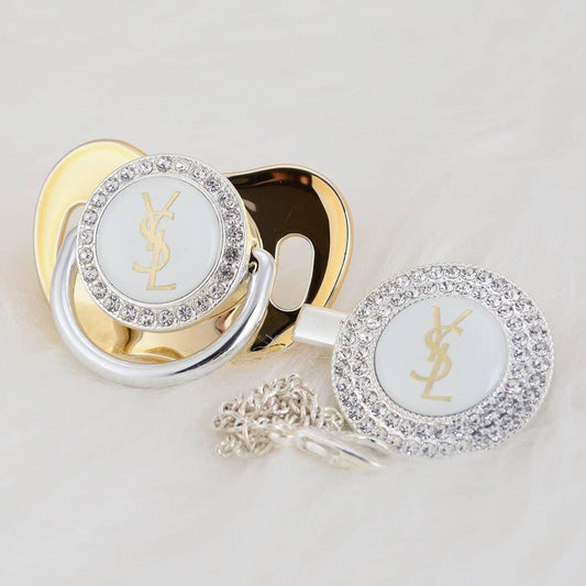 Premium Baby Schnuller Yves Saint Loren hellgold-weiß mit Clip & Geschenkbox